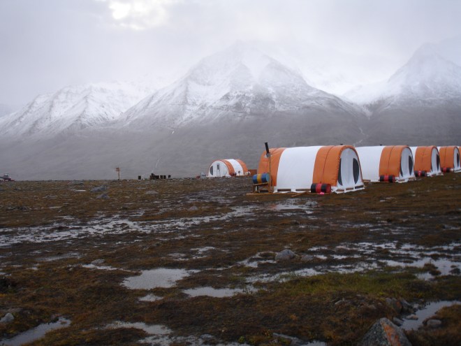 Rain clouds over the Stauning Alps of Eastern Greenland after the third day of rain... Exploratory mining camp tents in the foreground.